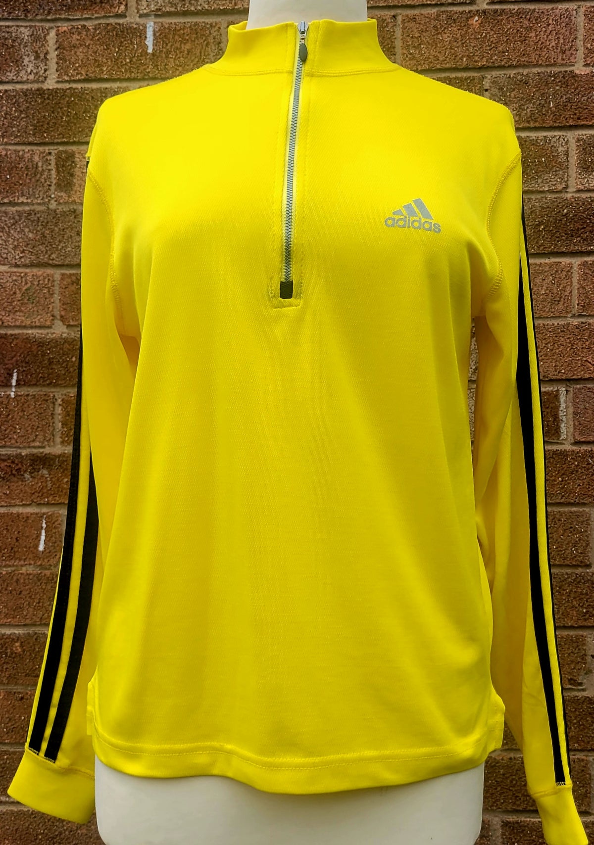 adidas ClimaLite quarter zip training top in neon yellow featuring reflective adidas chest logo, black Three Stripes sleeves and funnel neck, US large.