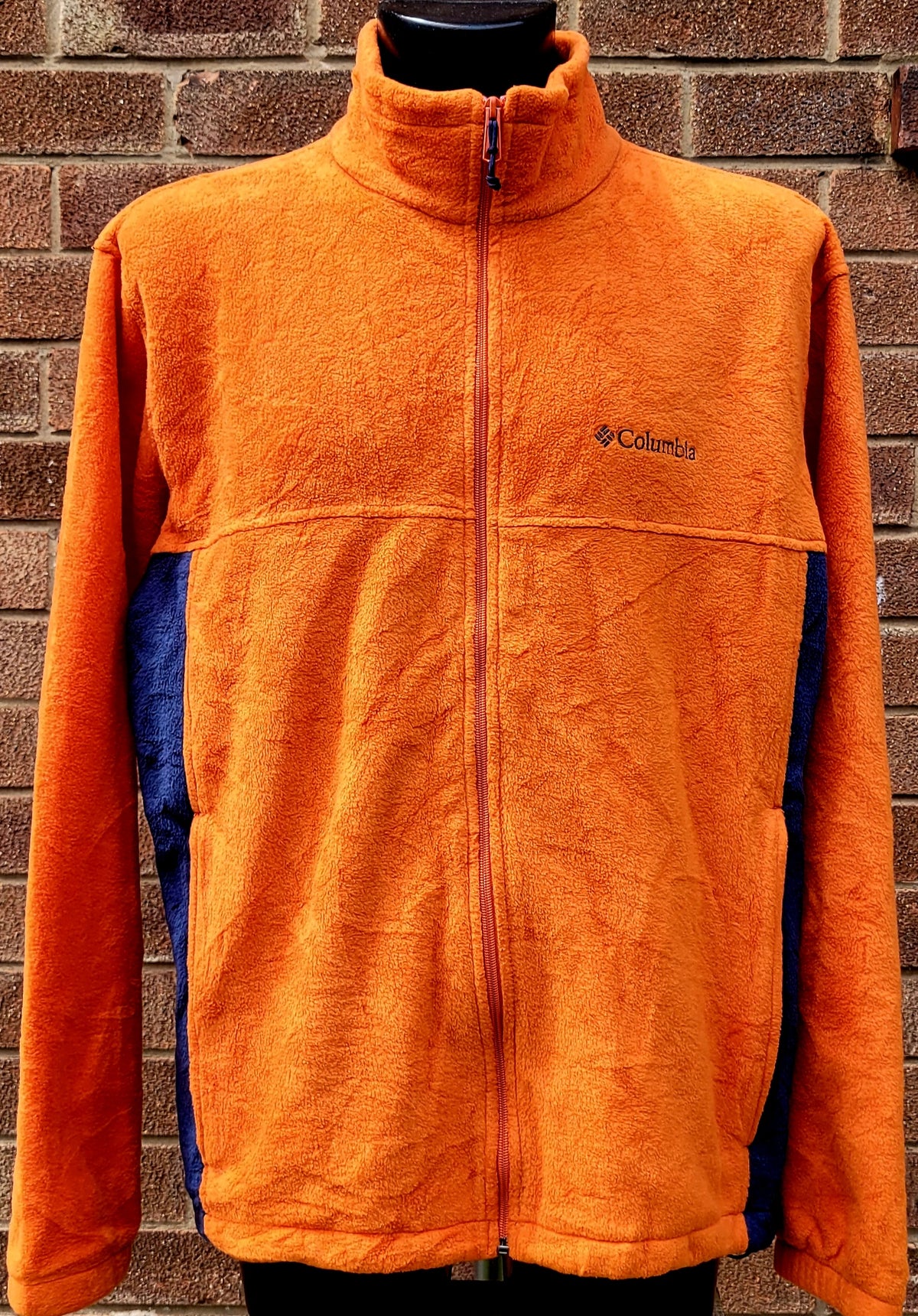 Columbia full zip fleece jacket in bright orange with navy side panels, embroidered Columbia chest logo, funnel neck and zipped hand pockets in men's XL.